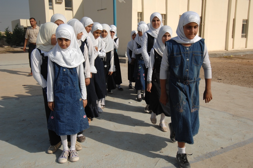 Children receive backpacks, other supplies