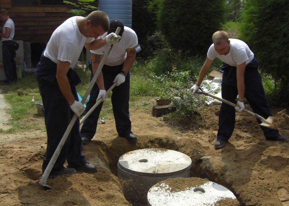 Sailors install septic tank in Thailand