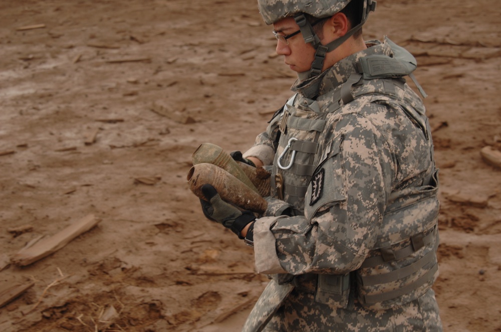 EOD soldiers prepare to blow weapons cache