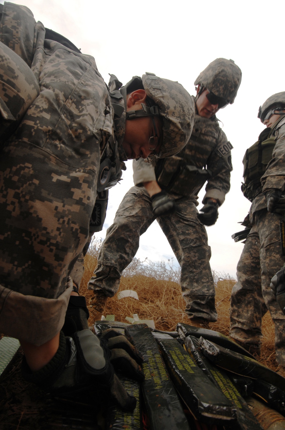 EOD soldiers prepare to blow weapons cache
