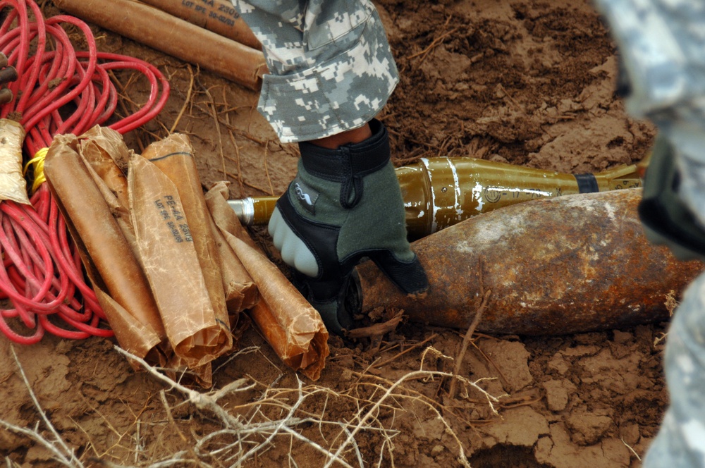 EOD soldiers prepare to blow weapons cache