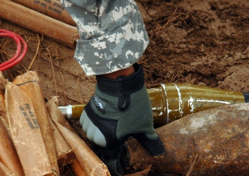 EOD soldiers prepare to blow weapons cache