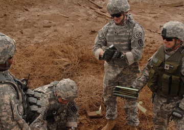 EOD soldiers prepare to blow weapons cache