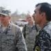 Iraqi policemen sort through equipment for sale, meet with soldiers and airmen