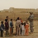 Soldiers Inspect Wells, Visit Children