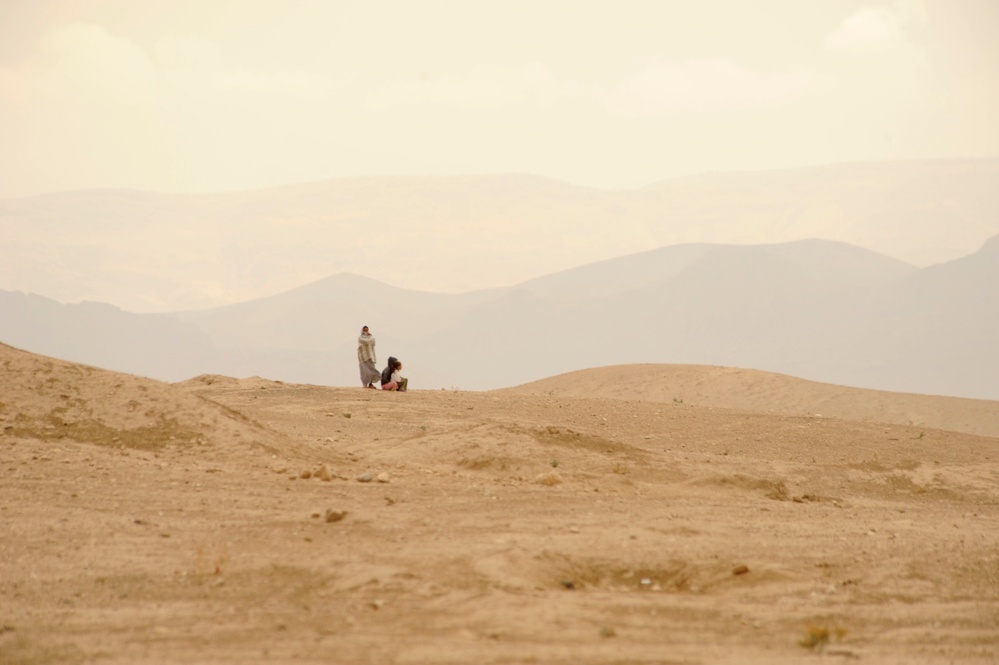 Soldiers Inspect Wells, Visit Children