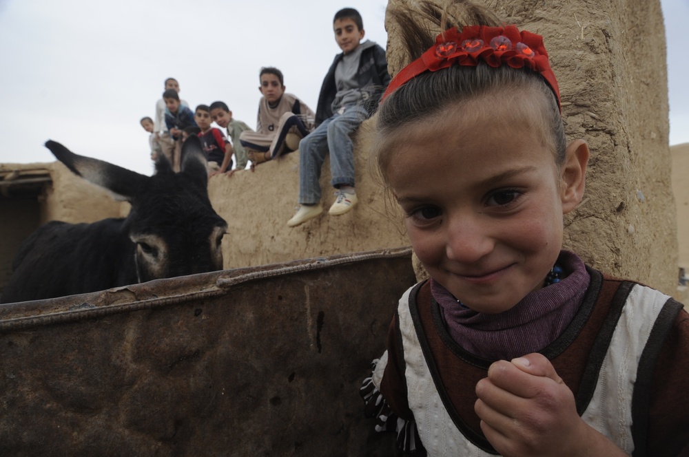 Soldiers inspect wells, visit children