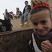 Soldiers inspect wells, visit children