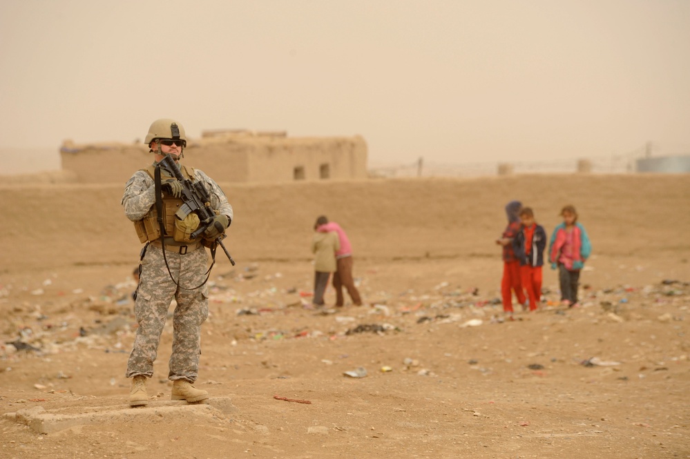Soldiers Inspect Wells, Visit Children