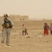 Soldiers Inspect Wells, Visit Children