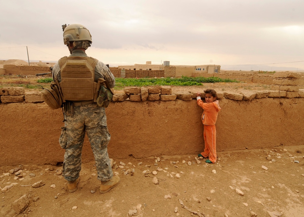 Soldiers Inspect Wells, Visit Children
