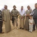Soldiers inspect wells, visit children