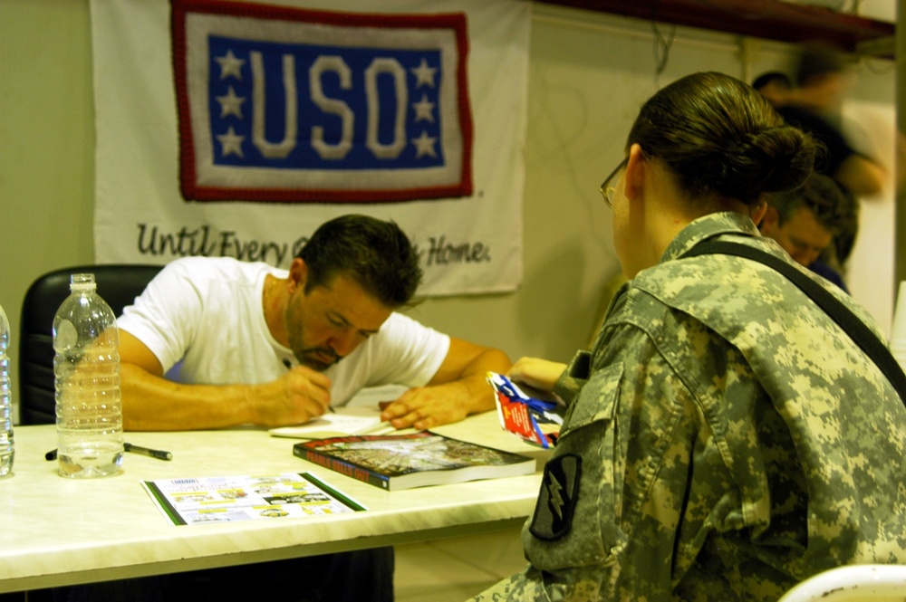 Cartoonists visit Q-West, draw stories from troops