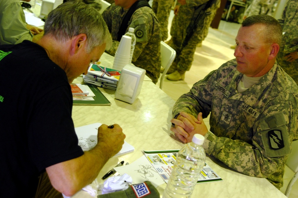 Cartoonists visit Q-West, draw stories from troops