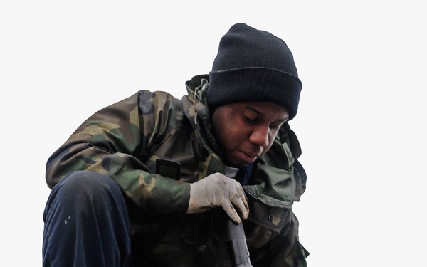 Sailor works on carrier catapult system