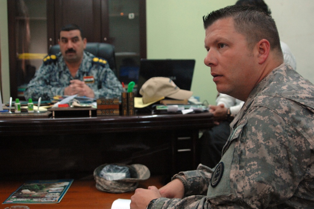 U.S. troops work with Iraqi police