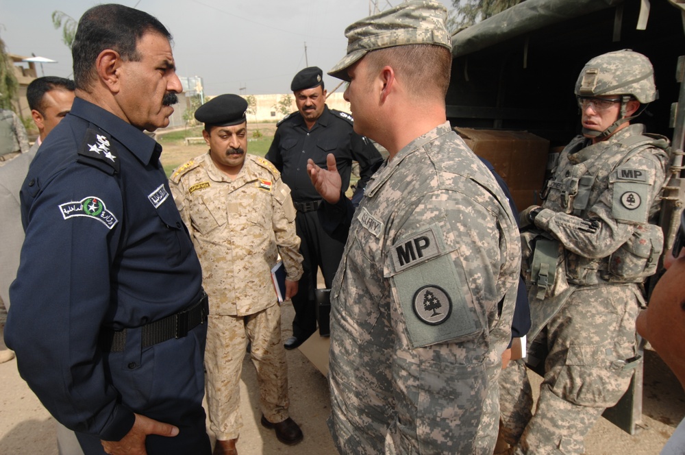 U.S. troops work with Iraqi police