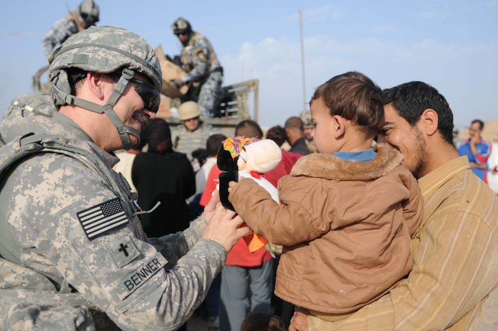 Soldiers give clothes, toys to local Iraqis