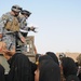 Soldiers give clothes, toys to local Iraqis