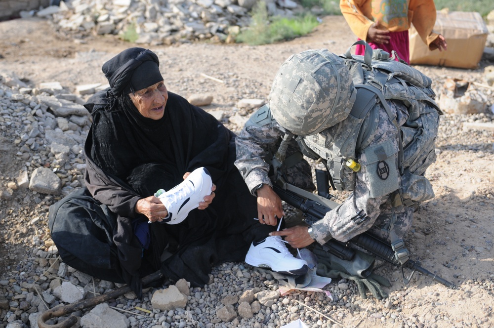 Soldiers give clothes, toys to local Iraqis