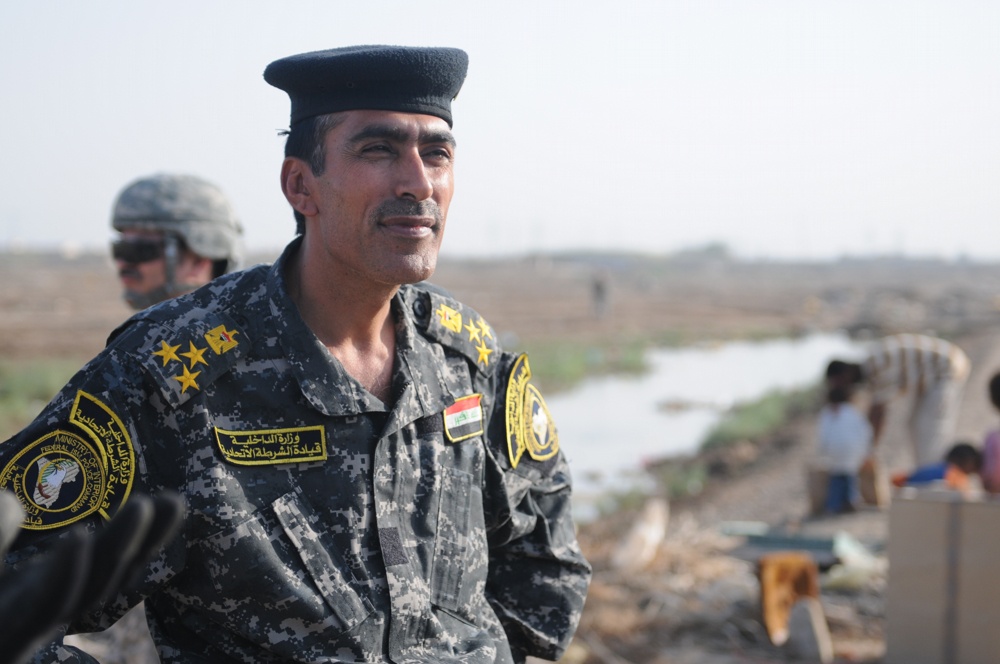 Soldiers give clothes, toys to local Iraqis