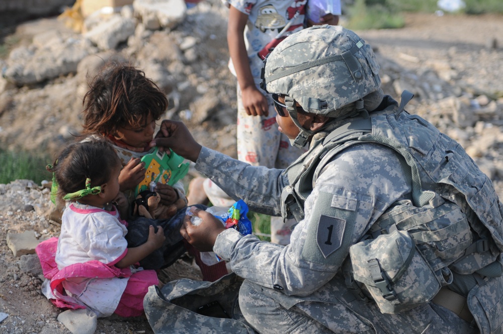 Soldiers give clothes, toys to local Iraqis