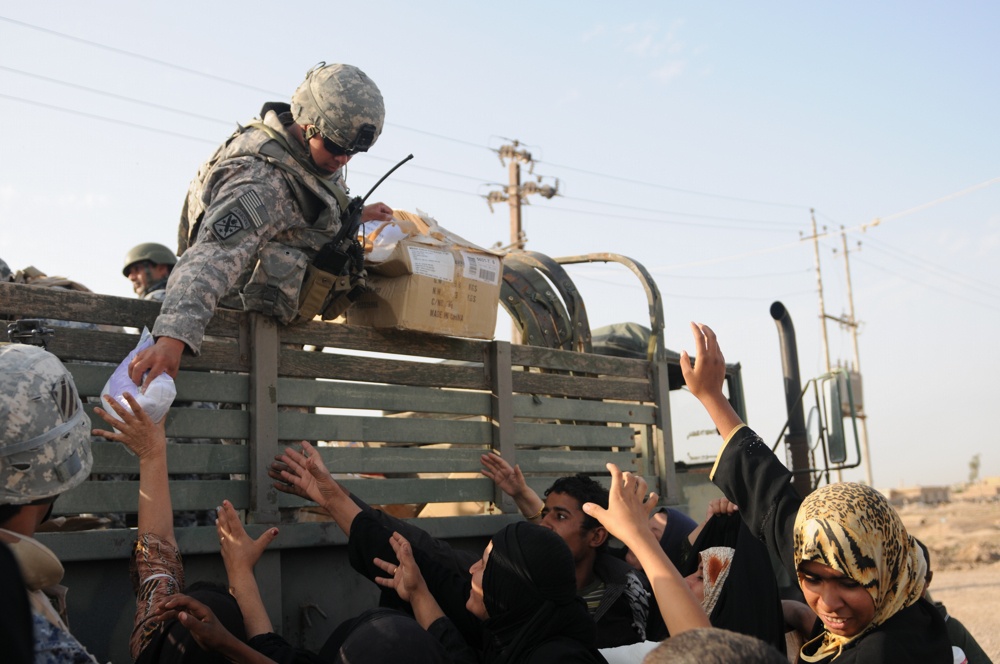 Soldiers give clothes, toys to local Iraqis
