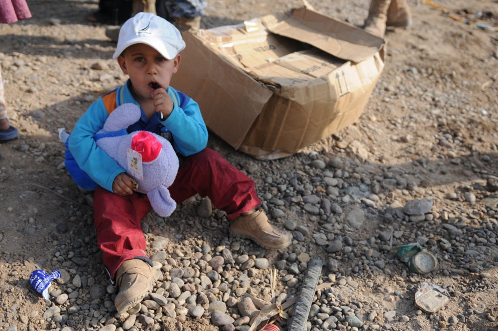 Soldiers give clothes, toys to local Iraqis