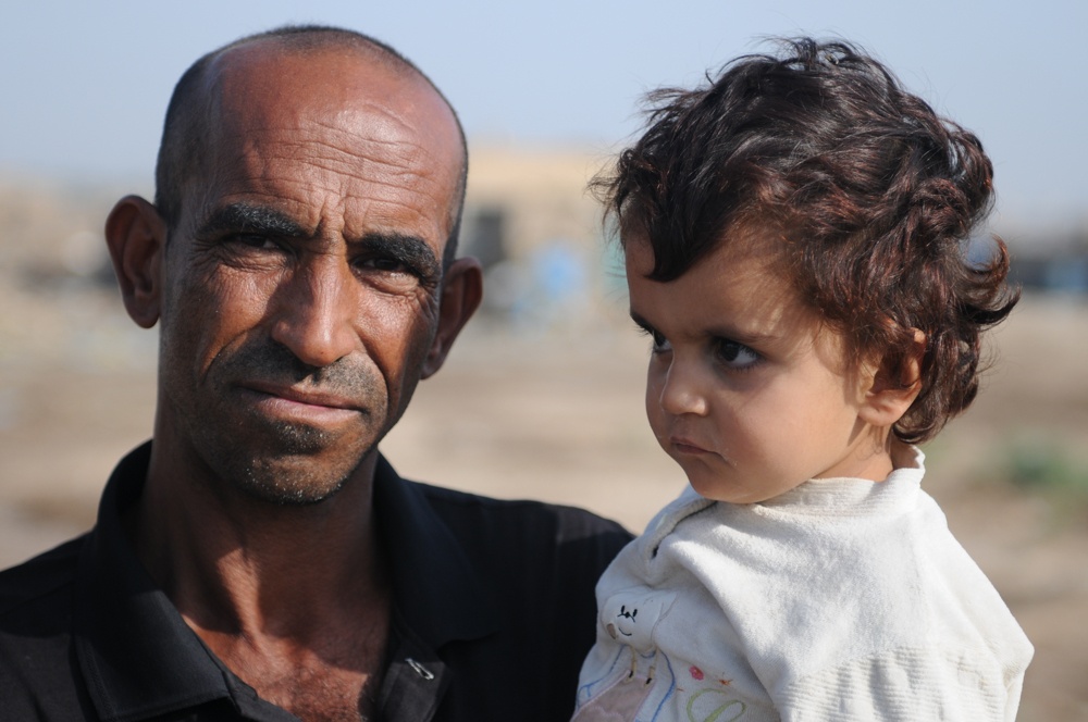 Soldiers give clothes, toys to local Iraqis