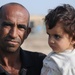 Soldiers give clothes, toys to local Iraqis