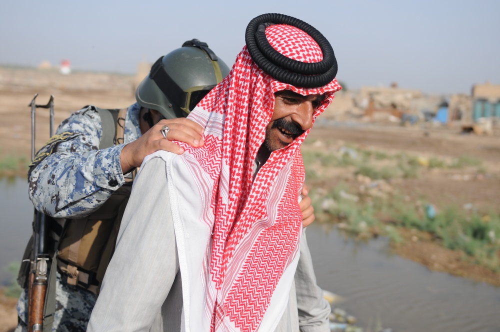 Soldiers give clothes, toys to local Iraqis