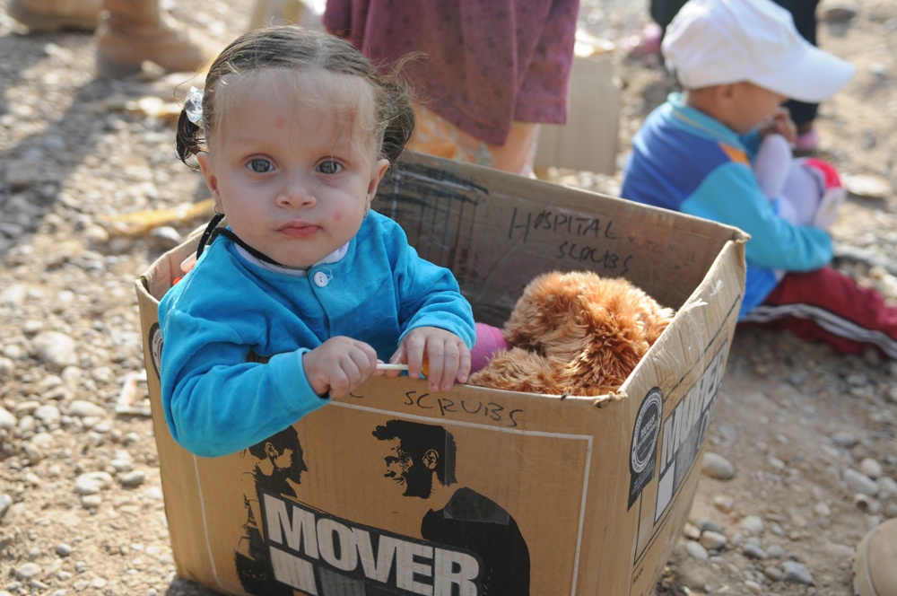 Soldiers give clothes, toys to local Iraqis