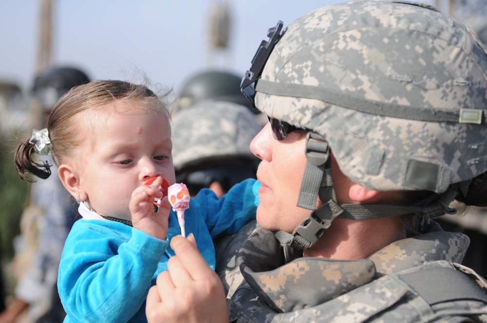 Soldiers give clothes, toys to local Iraqis