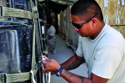 Tying the knot: Riggers secure loads for aerial deliveries.