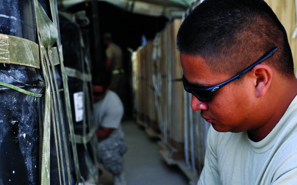 Tying the knot: Riggers secure loads for aerial deliveries.