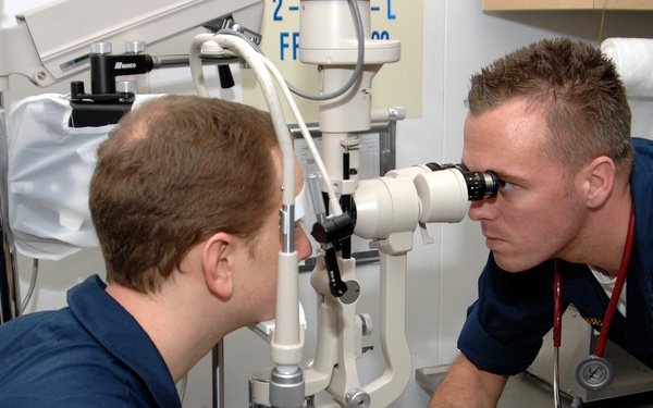Corpsman performs eye exam