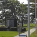 Soldiers walks past Ultimate Weapon statue