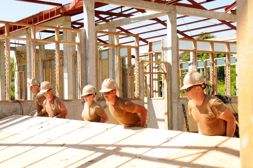 U.S. Navy Seabees, Local Residents Build School Together