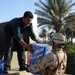 U.S., Iraqi troops deliver supplies to locals
