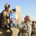 U.S., Iraqi troops deliver supplies to locals