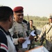 U.S., Iraqi troops deliver supplies to locals
