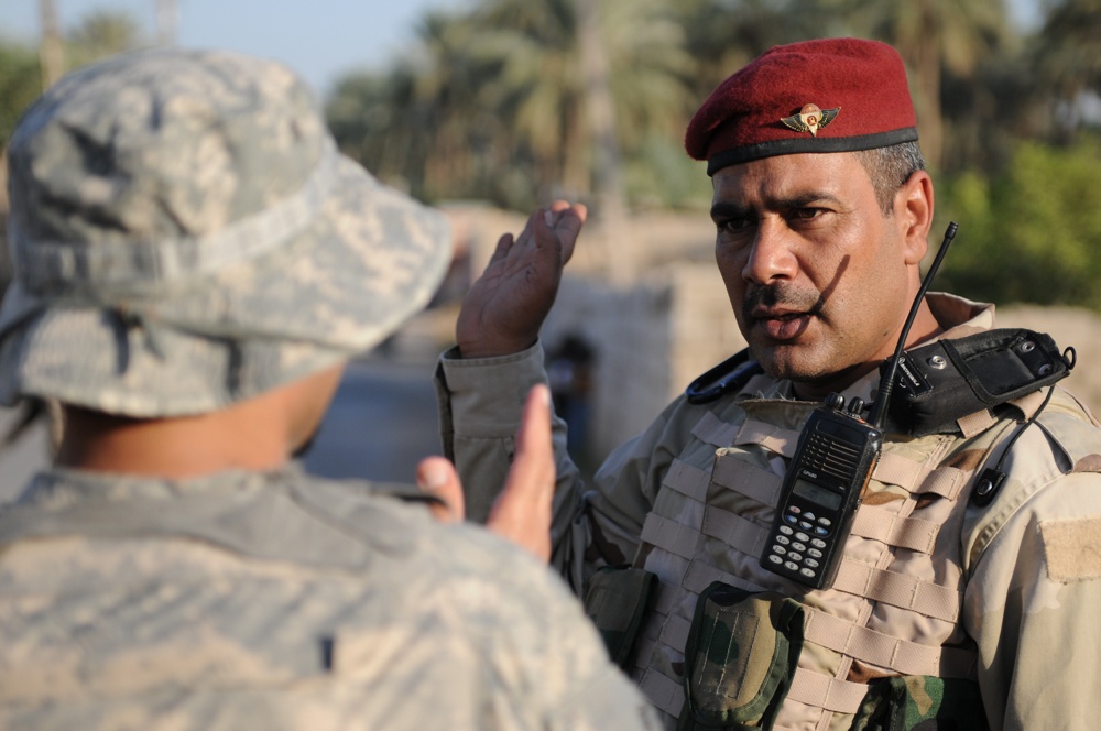 U.S., Iraqi troops deliver supplies to locals