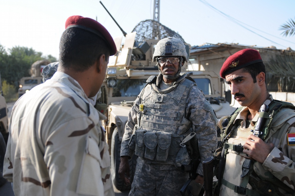 U.S., Iraqi troops deliver supplies to locals