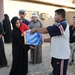 U.S., Iraqi troops deliver supplies to locals