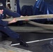 Sailors handle mooring lines