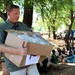 CJTF-HOA service members give supplies to African locals