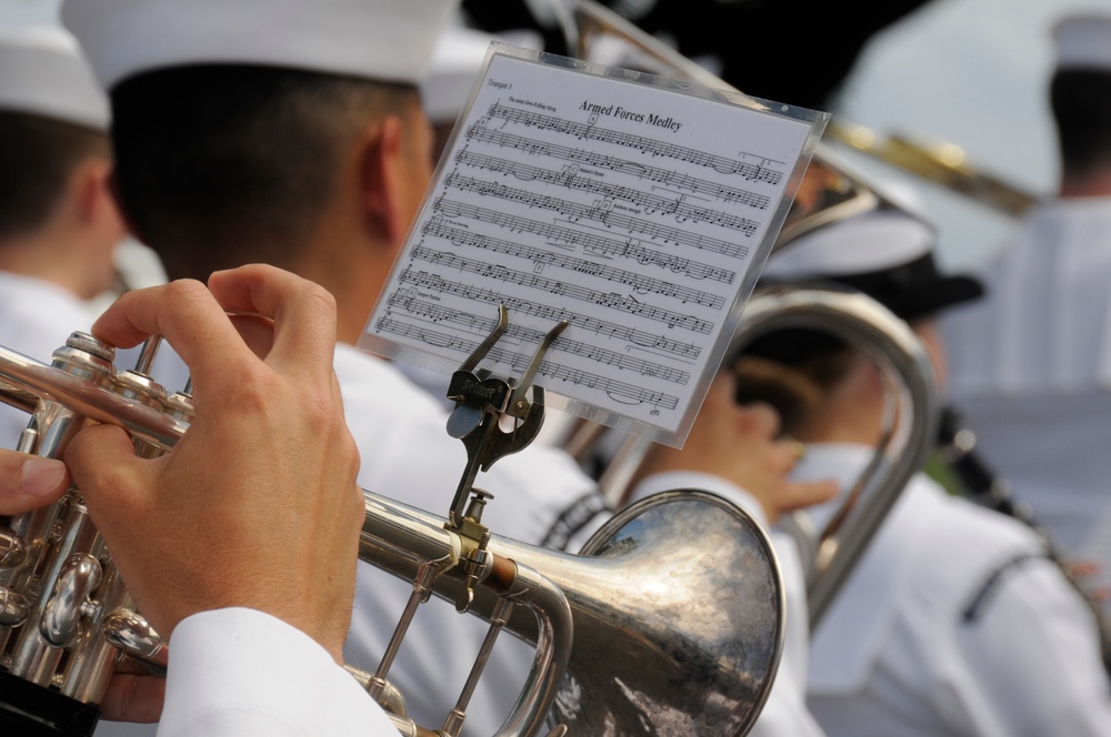 Sailors assigned to the U.S. Pacific Fleet Band march in a Veterans Day parade. More than 50 active, reserve and retired military units participated in the celebration.