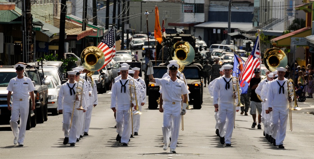 Sailors assigned to the U.S. Pacific Fleet Band march in a Veterans Day parade. More than 50 active, reserve and retired military units participated in the celebration.
