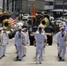 Sailors assigned to the U.S. Pacific Fleet Band march in a Veterans Day parade. More than 50 active, reserve and retired military units participated in the celebration.