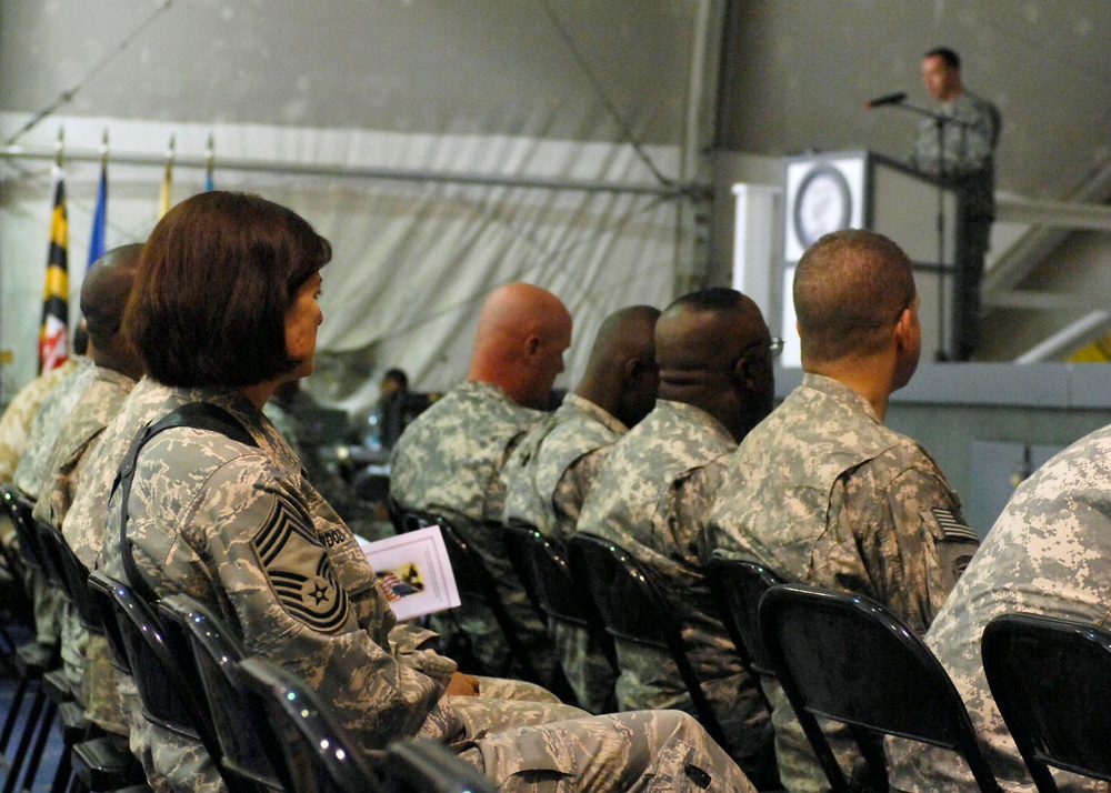 Chief Master Sgt. Stephanie Cardozo with Joint Task Force MED east/455th Expeditionary Medical Group, listens to Army Sgt. First Class Raleigh Sell, the protocol non-commissioned officer in charge from Combined Joint Task Force 82. Sell spoke at the Veter